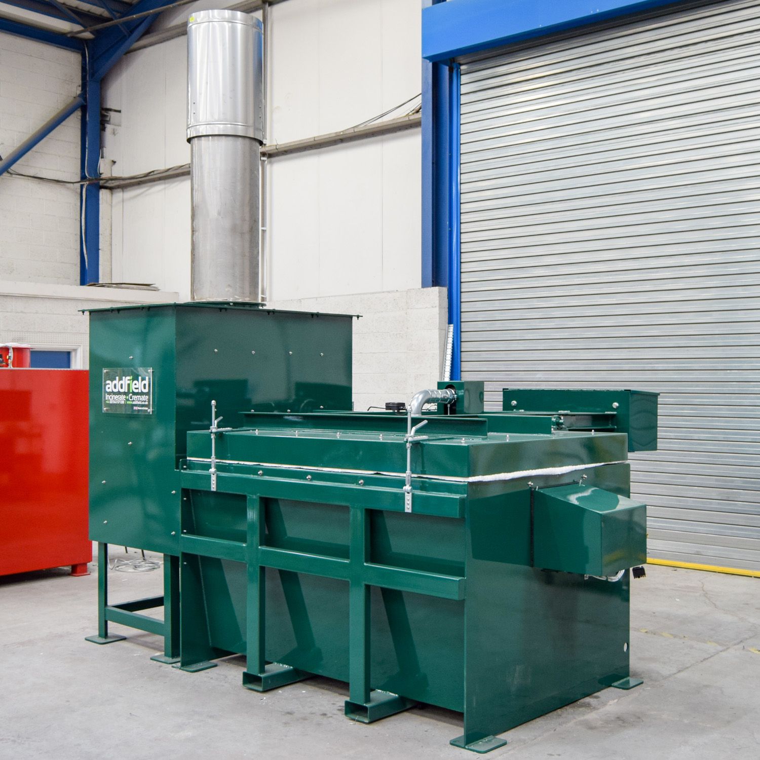The full machine from three-quarters, giving the footprint a waste room has to allow for.